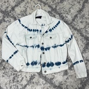Light wash denim jacket with blue pattern.